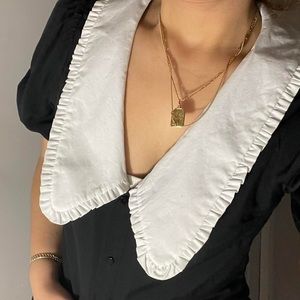 Crop top with long collar and puff sleeves